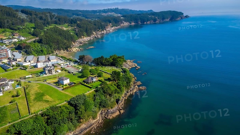 Breathtaking aerial view of covas beach meeting the cantabrian sea, showcasing the stunning coastline of viveiro, galicia, spain