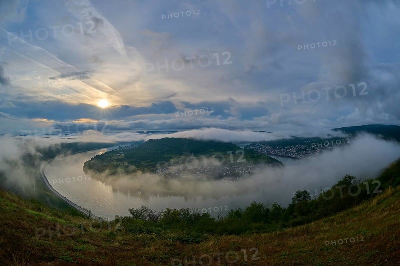 River landscape in a bend with misty hills and cloudy sky illuminated by the sunrise, summer, Rhine bend Boppard, Gedeonseck, Boppard, Rhine, Rhine-Hunsrück district, Rhineland-Palatinate, Germany