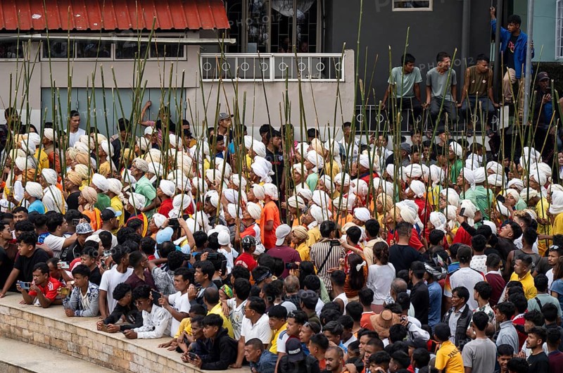 JOWAI, INDIA - JULY 14: People from the Pnar community attend the Behdienkhlam festival in Jowai, India on July 14, 2025. Behdienkhlam is a vibrant annual festival celebrated by the Pnar (Jaintia) community of Meghalaya, especially in Jowai, to drive away plague and diseases and to pray for a good harvest. Observed in July after the sowing season, it features traditional rituals, offerings to ancestral spirits, and the grand procession of beautifully decorated bamboo structures called rots, which are later immersed in a sacred muddy pool known as Ka Aitnar