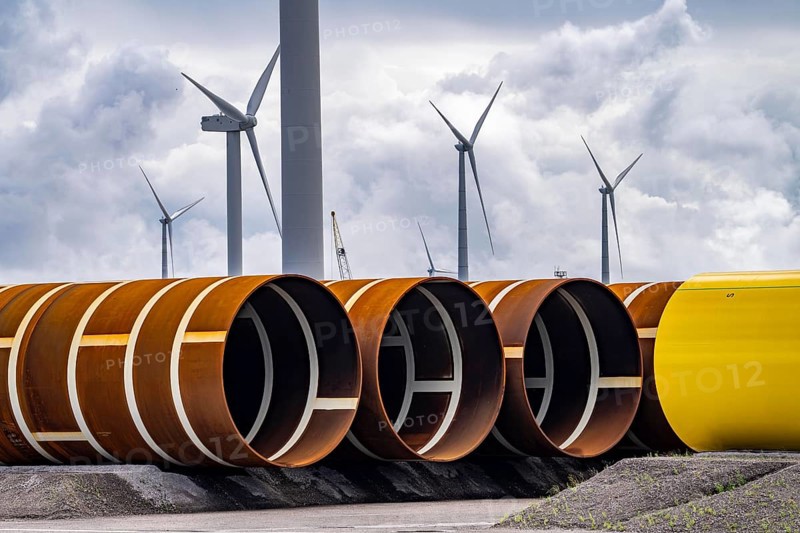 The seaport of Eemshaven, Julianahaven Basin, where the foundation structures, monopiles, for offshore wind farms are stored, which then support the actual wind turbines, the components are transported to the wind farms in the North Sea on large workboats and anchored to the seabed, where the wind turbines are then built, Eemshaven, Netherlands