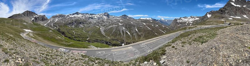 Panorama of southern ascent south ramp alpine road mountain road above above tree line highest asphalted passable 2770 2764 metres high alpine pass Col d'iseran far right in the picture pass summit and chapel Chapelle Notre-Dame-de-Toute-Prudence, Col de l'Iseran, departmental road D902, Route des Grandes Alpes, Département Savoie, Region Auvergne-Rhône-Alpes, Graian Alps, France