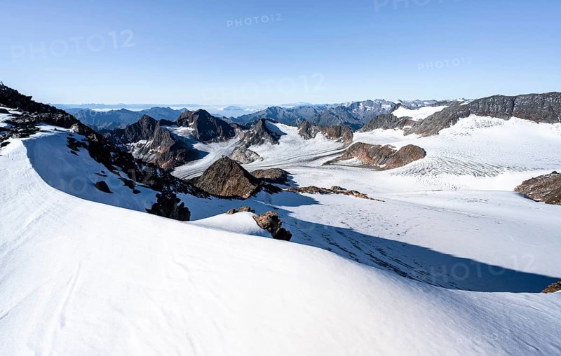 Snow on the Wilder Freiger mountain peak, picturesque high mountain landscape, view of Übeltalferner glacier and rocky mountain peaks Königshofspitz and Sonklarspitze, Stubai Alps, South Tyrol, Italy