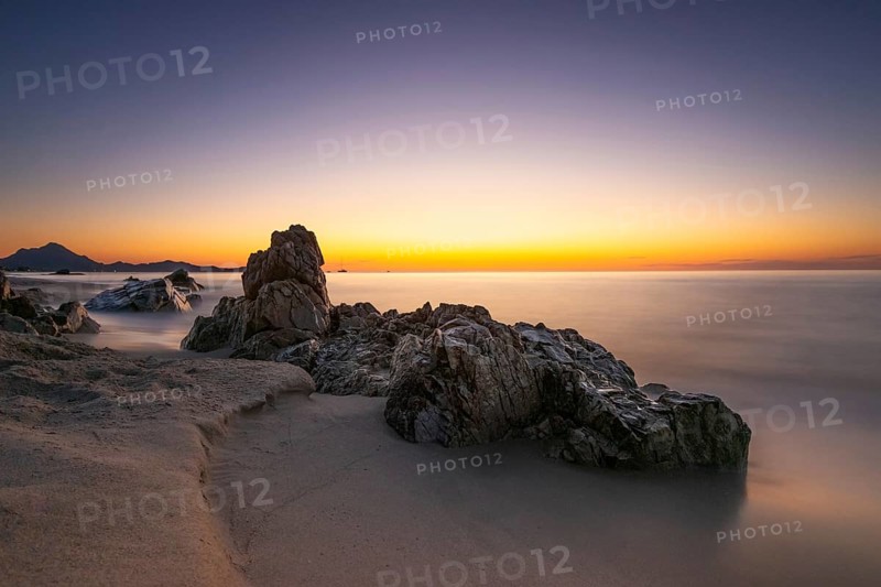The sun rises on the Costa Rei, a stretch of coastline on the Italian Mediterranean island of Sardinia, Monte Nai, Costa Rei, Sardinia, Italy