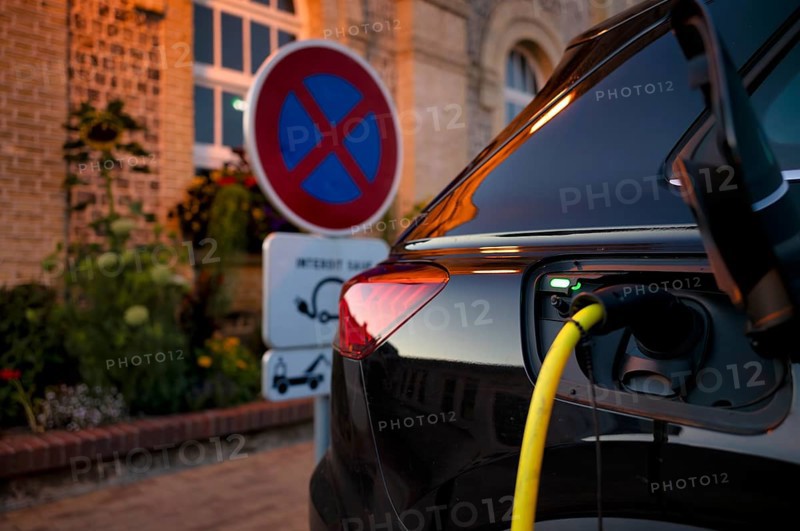 Charging station for electric cars, electric charging station, e-charging station, e-mobility, charging cable leads into Audi 45 e-tron electric car, traffic sign, absolute stopping ban, Étretat, Normandy, Seine-Maritime, France