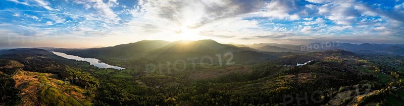 Panorama of Sunset over Mountains and Coniston Water from drone, Lake District National Park, Cumbria, England, United Kingdom