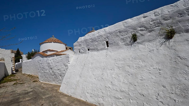 Church of Agia Kioura, White monastery wall under a blue sky, simple and traditional, Church, Chora, World Heritage Site 1999, Patmos, Dodecanese, Greek Islands, Greece