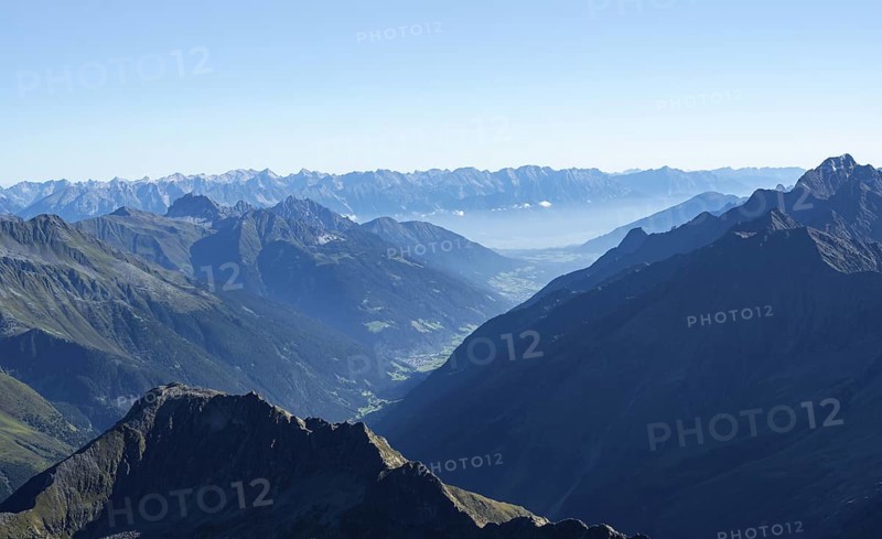 View of the Stubai Valley, mountain silhouettes, from the summit of the Wilder Freiger, Stubai Alps, South Tyrol, Italy