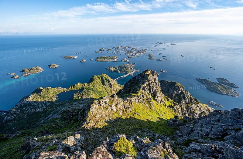 View of numerous small rocky islands with houses, at the summit of Festvågtind, view of Henningsvær, Vågan, Lofoten, Nordland, Norway