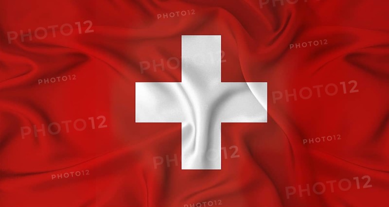 Realistic Switzerland flag waving. Close up of flag of Switzerland with cloth texture