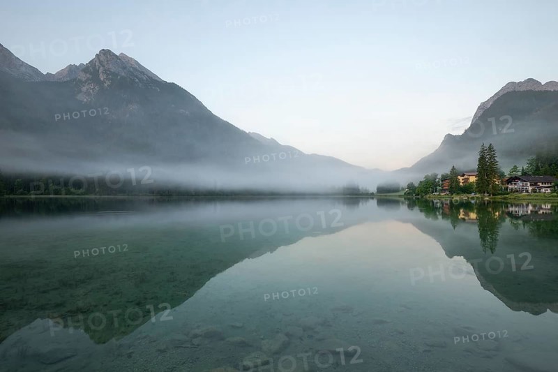 Magical sunrise with fog at Hintersee near Ramsau in Berchtesgadener Land