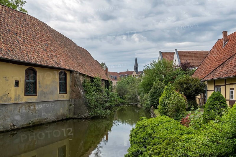 Steinfurter Aa, part of the castle moat at Burgsteinfurt Castle, also known as Steinfurt Castle, Münsterland, North Rhine-Westphalia, Germany