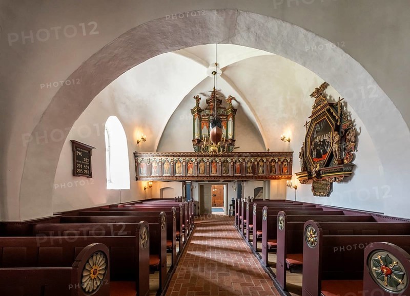 Pews and organ in Gothic interior with decorative details, 14th century church, Old Town, Ringkøbing, Ringkøbing Fjord, Denmark