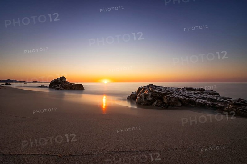 The sun rises on the Costa Rei, a stretch of coastline on the Italian Mediterranean island of Sardinia, Monte Nai, Costa Rei, Sardinia, Italy