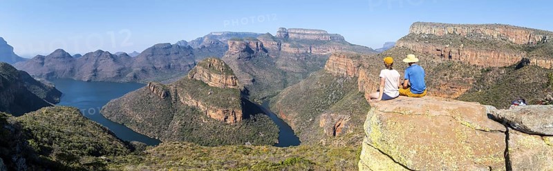 Two hikers enjoying panorama, Blyde River Canyon with Three Rondawels peak, view of gorge with Blyde River and table mountains, canyon landscape, Panorama Route, Mpumalanga, South Africa