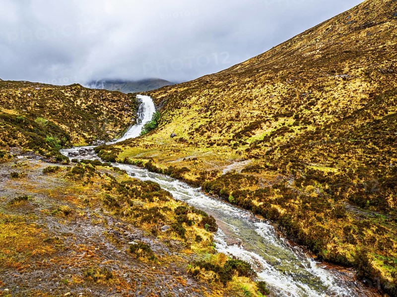 Eas a' Bhradain waterfall, Red Cuillin mountains, Loch Ainort, Isle of Skye, Scotland, UK