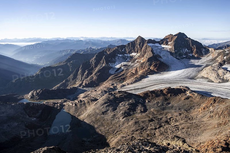 Picturesque high mountain landscape at sunrise, glacier and rocky mountain peaks in the morning light, view of the Königshofspitz mountain peak and Übeltalferner glacier at Becher, Stubai Alps, South Tyrol, Italy
