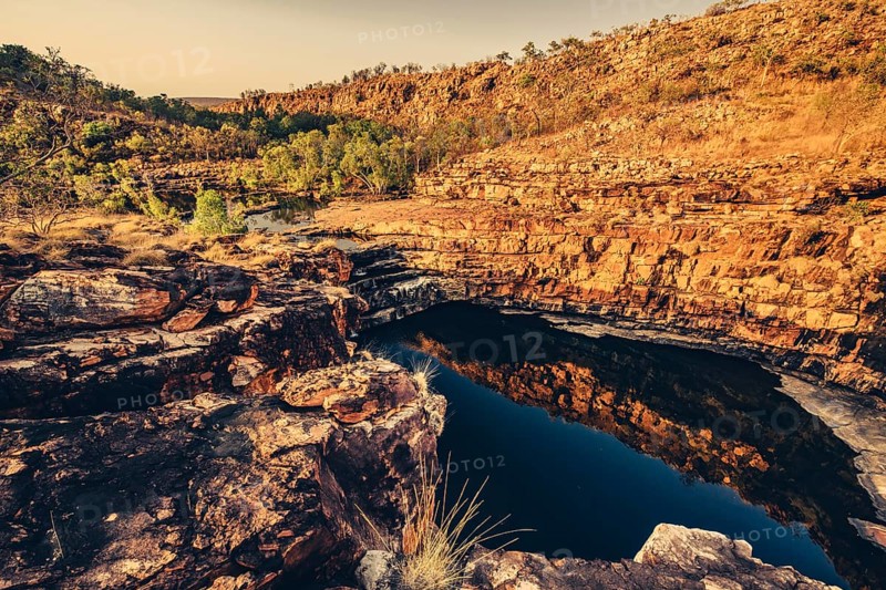 Bell Gorge waterfall, a body of water in north-west Australia in the Kimberley. Sunrise in the outback, Australia