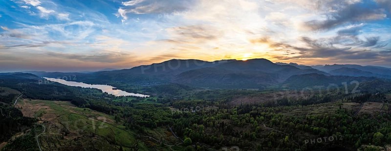 Panorama of Sunset over Mountains and Coniston Water from drone, Lake District National Park, Cumbria, England, United Kingdom