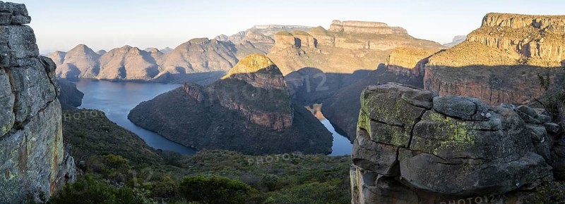 Panorama, sunset at Blyde River Canyon with Three Rondawels peak, view of canyon with Blyde River and table mountains in the evening light, canyon landscape, Panorama Route, Mpumalanga, South Africa
