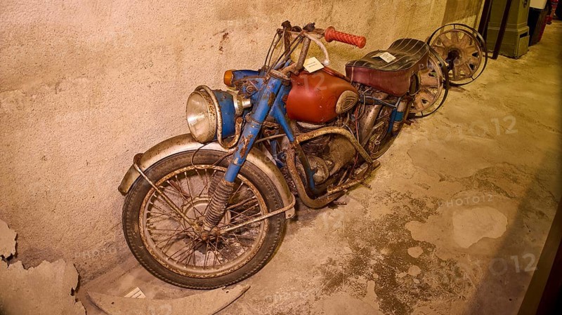 An old, dusty motorbike on display in a bunker, War Museum, Military Museum, Tunnel Museum, Lakki, Leros, WW2, Dodecanese, Greek Islands, Greece