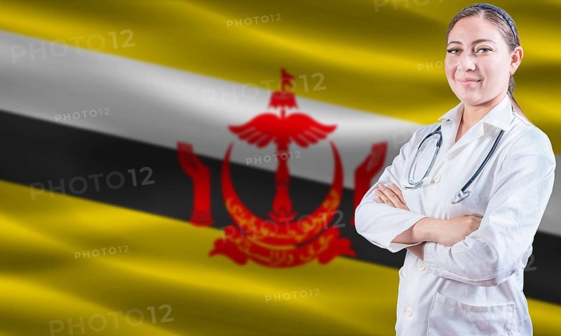 Female doctor on Brunei flag. Doctor with crossed arms on Brunei flag. Brunei health and care concept