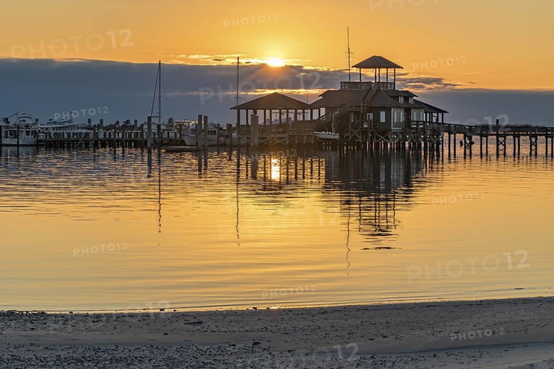 Biloxi Schooner Pier Complex at sunset on the Gulf of Mexico at Biloxi, Mississippi, USA