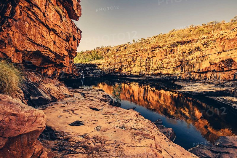 Bell Gorge waterfall, a body of water in north-west Australia in the Kimberley. Sunrise in the outback, Australia