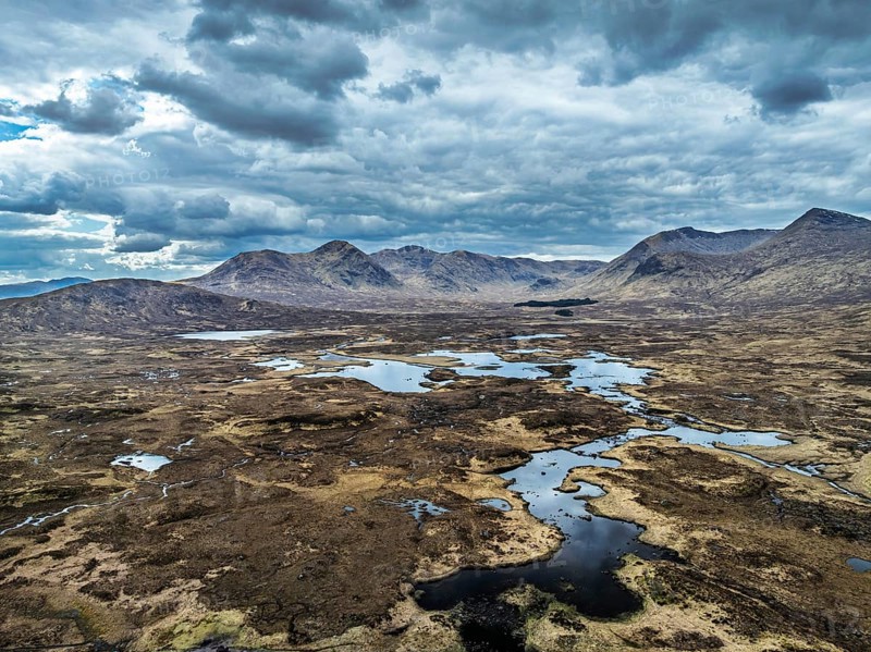 Rannoch Moor from a drone over Loch Ba and Loch of the Armpit, A82 Highland Way, Argyll and Bute, West Highlands, Scotland, United Kingdom
