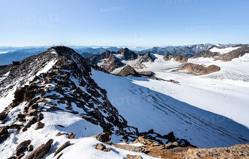 Snow on the Wilder Freiger mountain peak, picturesque high mountain landscape, view of Übeltalferner glacier and rocky mountain peaks Königshofspitz and Sonklarspitze, Stubai Alps, South Tyrol, Italy