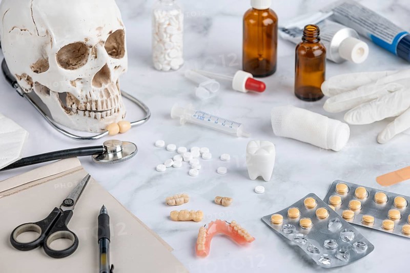 Medical utensils, tablets with skull and teeth