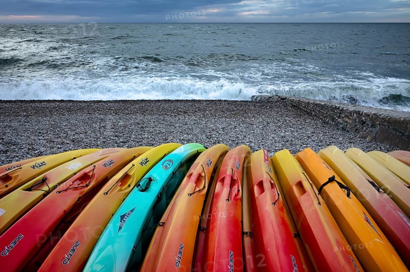 Kayaks, boats, colourful, lying on the beach, pebble beach, Étretat, sea, Normandy, Seine-Maritime, France