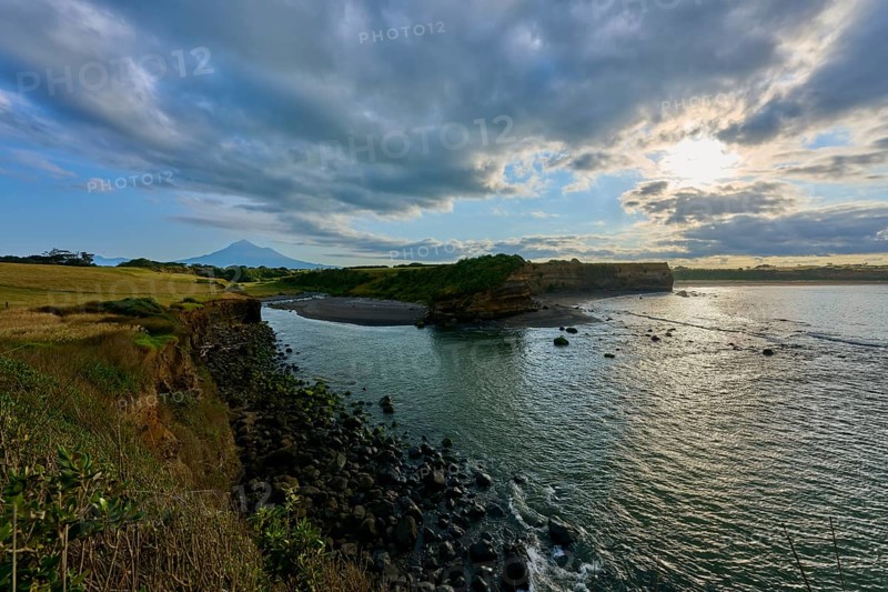 Coastal landscape with sea, cliffs and cloudy sky, calming atmosphere, Opunake, Egmont Volcano, Taranaki, North Island, New Zealand