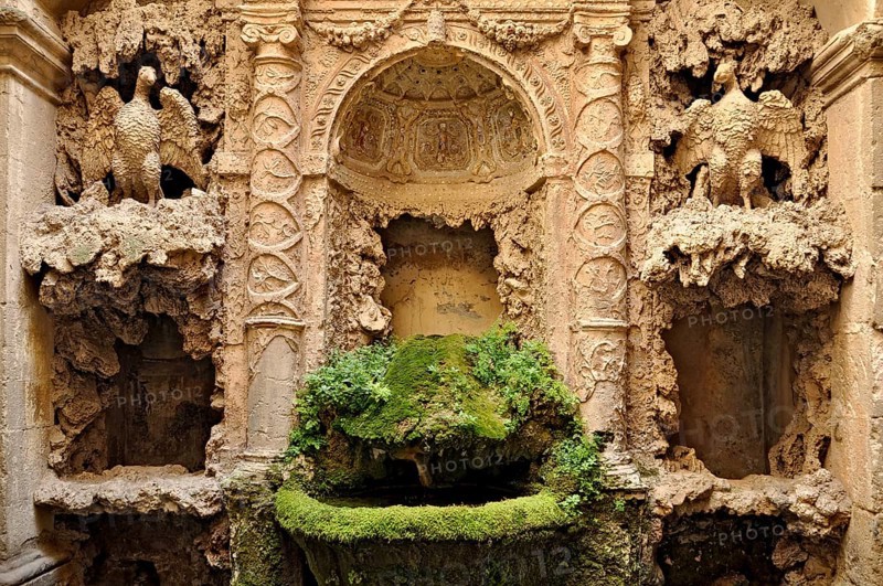 Ornamental fountain from the Renaissance, fountain with moss and artificial dripstone from the Mannerist period, courtyard of Palazzo Conti, historic centre, Poli, Monti Prenestini, metropolitan city of Rome, Lazio, Italy