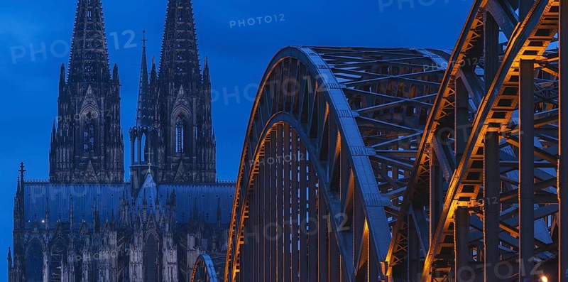 Cologne Cathedral and the Hohenzollern Bridge illuminated with LED lights, Cologne, North Rhine-Westphalia, Germany