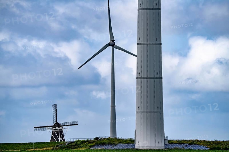 Westereems and Growind wind farms, over 80 wind turbines in total, at the Eemshaven seaport, province of Groningen, in the north-west of the Netherlands, historic Goliath windmill from 1897
