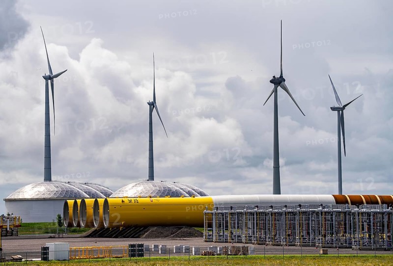 The seaport of Eemshaven, Julianahaven Basin, where the foundation structures, monopiles, for offshore wind farms are stored, which then support the actual wind turbines, the components are transported to the wind farms in the North Sea on large workboats and anchored to the seabed, where the wind turbines are then built, Eemshaven, Netherlands