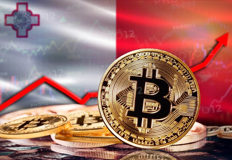 Bitcoin with Malta flag in the background. Bitcoin rising with Malta flag in the background
