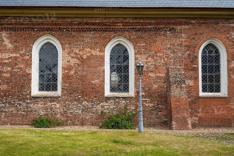 Brick façade with window, St Laurentius Church, town church, market, old town, Tönning, North Frisia, Schleswig-Holstein, Germany