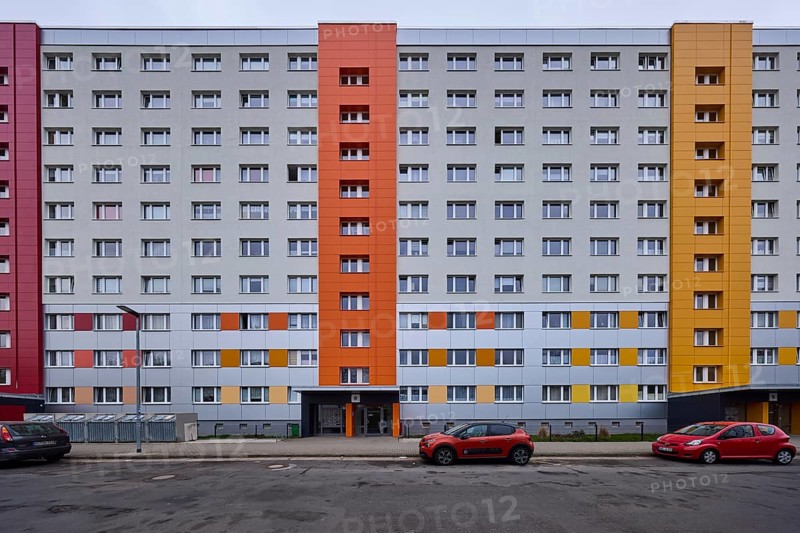 High-rise buildings, residential buildings, residential silos, facade, window, car park with vehicles, lantern, diffuse light, cloudy, Pablo-Neruda-Straße, Magdeburg, state capital, independent city, Saxony-Anhalt, Germany