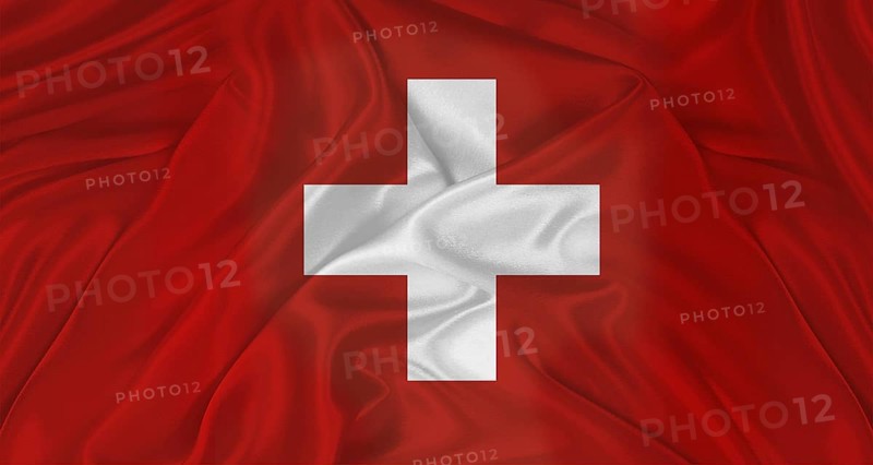Flag of Switzerland with cloth texture. Close up of Swiss flag waving