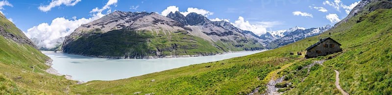 Panorama, blue mountain lake and alpine hut in mountain landscape, Lac des Dix reservoir and Mont Blanc de Cheilon peak, Valais Alps, Valais, Switzerland