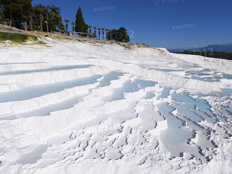 Cascading white terraces with turquoise water against a blue sky, aerial view, sinter terraces, limestone sinter terraces, travertine terraces, Pamukkale, Denizli, UNESCO World Heritage Site, Anatolia, Turkey