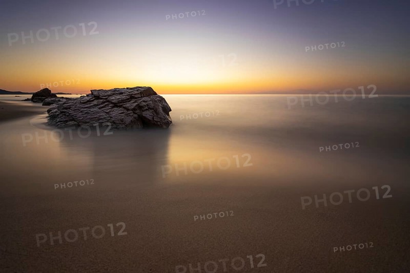 The sun rises on the Costa Rei, a stretch of coastline on the Italian Mediterranean island of Sardinia, Monte Nai, Costa Rei, Sardinia, Italy