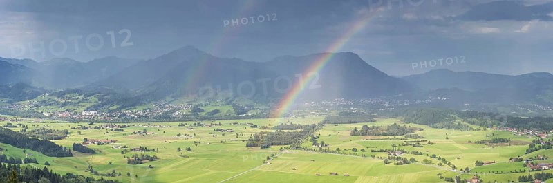 Panorama from Grünten over the Illertal with rainbow to Blaichach and Immenstadt, behind Steineberg, 1660m and Mittagberg, 1451m, Allgäu Alps, Allgäu, Bavaria, Germany