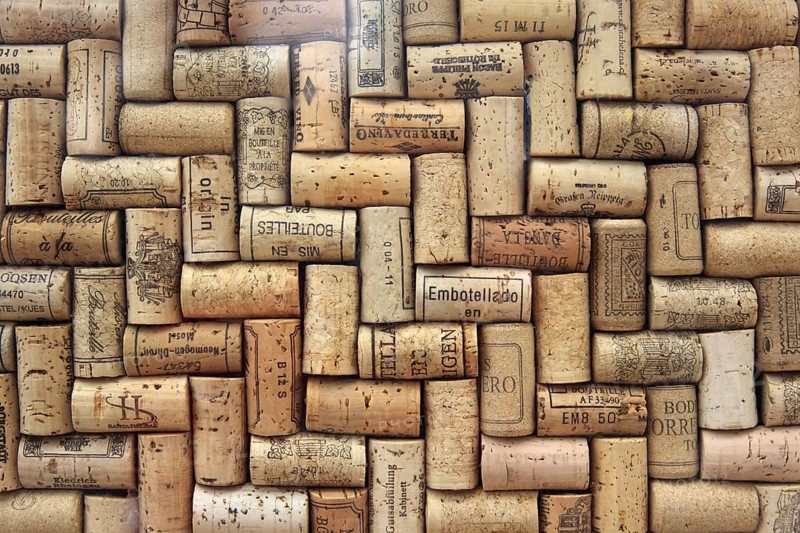 Corks from wine bottles laid as a regular pattern, wine corks, red wine