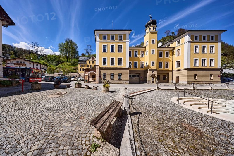Town hall, historical building, bench, barrier chain, square, cobblestones, stairs, mountain landscape, hill, forest, trees, flower pots, blue sky, cumulus clouds, cirrostratus clouds, town hall square, Berchtesgaden, Upper Bavaria, district Berchtesgadener Land, Bavaria, Germany