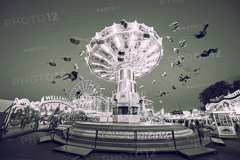 Sepia photograph of a merry-go-round at a funfair in motion, merry-go-round, spring festival, Cannstatter Wellenflug, illuminated, Cannstatter Wasen, Bad Cannstatt, Stuttgart, Baden-Württemberg, Germany
