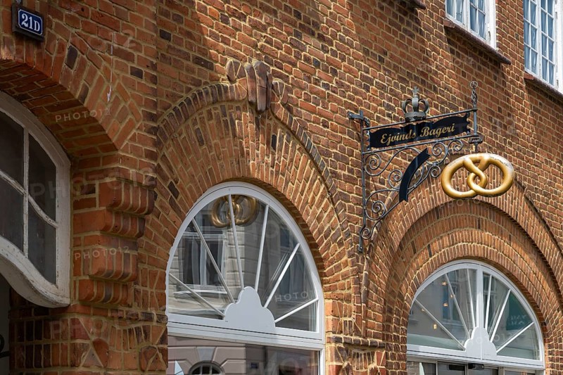 Brick building with bakery and wrought-iron sign, Old Town, Ringkøbing, Ringkøbing Fjord, Denmark