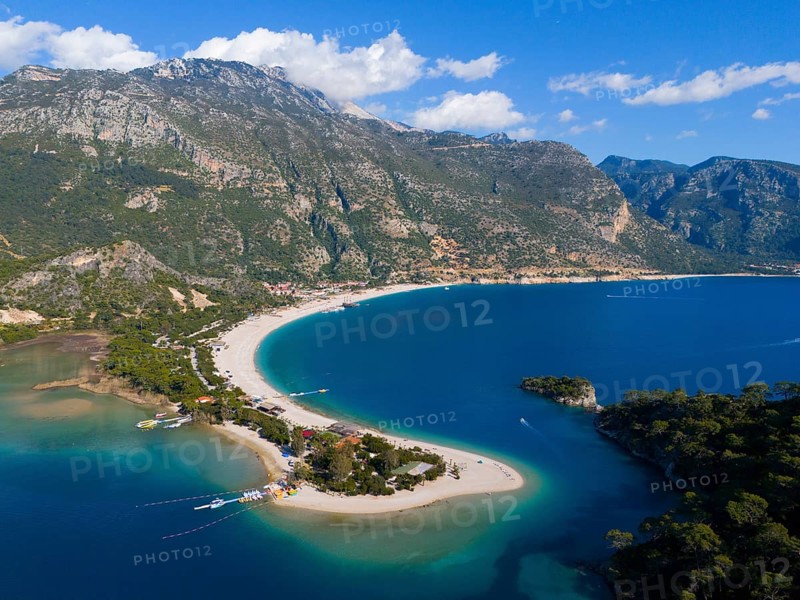 Aerial view of a picturesque coastline with sandy beach, mountains and clear water under a blue sky, aerial view, Fethiye, Mugla, Mugla, Aegean Sea, Turkey