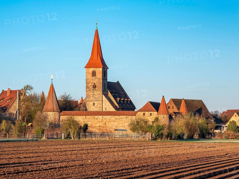 The medieval fortified church of St. George in the district of Kraftshof, Nuremberg, Middle Franconia, Bavaria, Germany